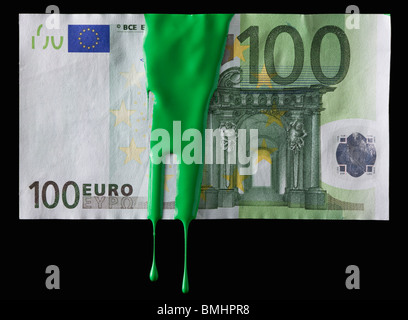 Green paint on a 100 euro bill Stock Photo