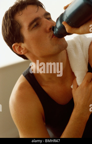 Man drinking water after exercising Stock Photo
