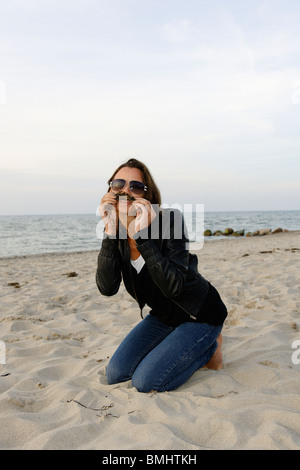 Young woman, 20+, on a beach, casual, fun, athletic, Niendorf on the Baltic Sea, Schleswig-Holstein, Germany, Europe