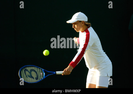 martina navratilova plays a backhand at wimbledon 2004 Stock Photo