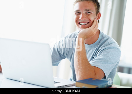 Young man working on laptop Stock Photo