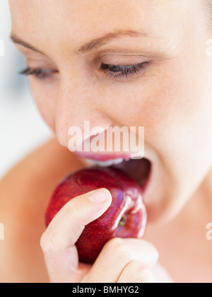 Woman eating an apple Stock Photo