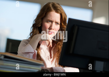 Woman working at computer Stock Photo