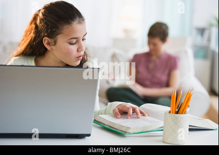 Young girl doing homework Stock Photo
