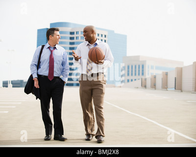 Businessman on their way to basketball game Stock Photo