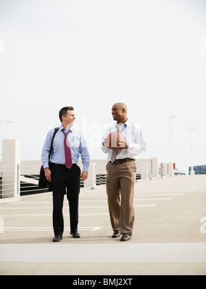 Businessman on their way to basketball game Stock Photo