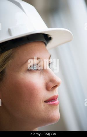 Female architect wearing a hard hat Stock Photo