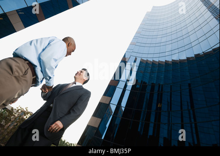 Two businessmen shaking hands Stock Photo
