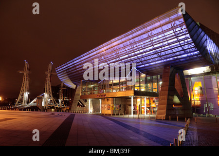 A side view of The Lowry, an art & entertainment centre in Salford Quays, Manchester, UK with the Salfard Millennium Bridge. Stock Photo