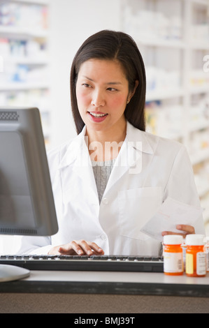 Pharmacist working on computer Stock Photo
