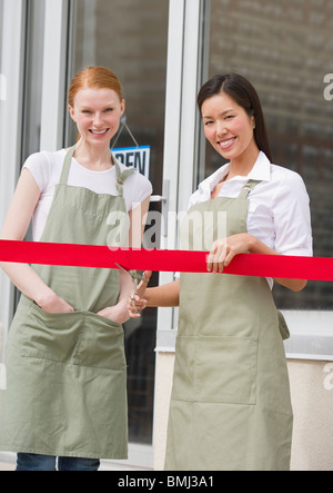 Cutting red ribbon at opening ceremony Stock Photo