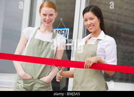 Cutting red ribbon at opening ceremony Stock Photo