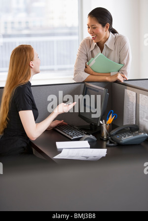 Businesswomen socializing at work Stock Photo