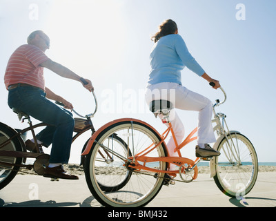 Couple riding bicycles Stock Photo