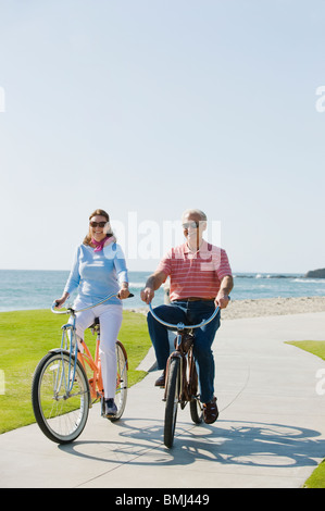 Couple riding bicycles Stock Photo