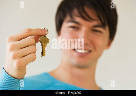 Man holding keys Stock Photo