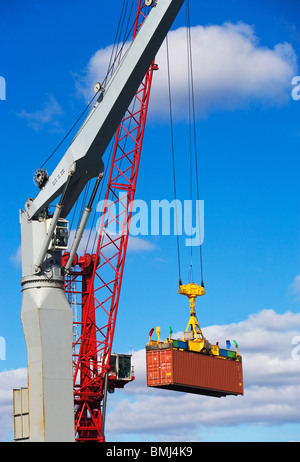 Vertical view of cranes loading and unloading container ships at a deep ...