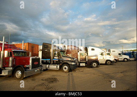 Semi tractor trailer trucks at a truckstop. Ellensburg Washington, USA Stock Photo