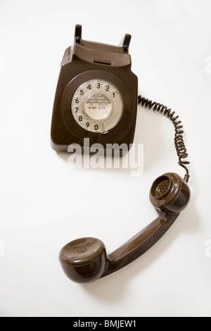 Off the hook GPO / Post office domestic residential telephone from around 1970, with dial. Stock Photo