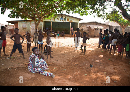 West Africa, Benin. Children gathered in village before Gelede Mask Dance. Stock Photo