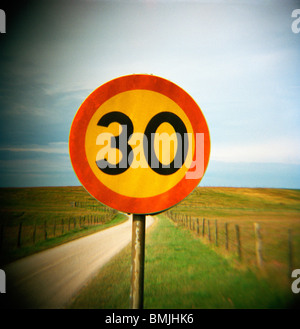 An old traffic sign by a country road, Sweden. Stock Photo