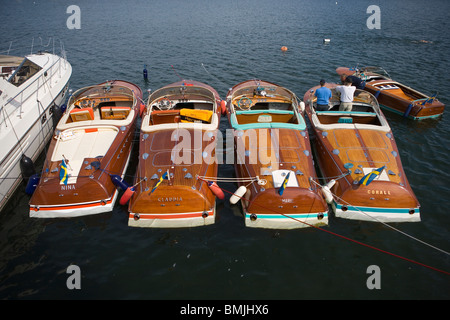 View of row of boats with two men, elevated view Stock Photo