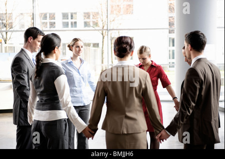 Group of business people forming circle Stock Photo