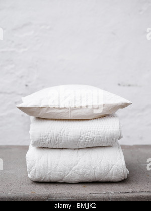 Scandinavia, Sweden, Stockholm, Folded blankets and quilt, close-up Stock Photo