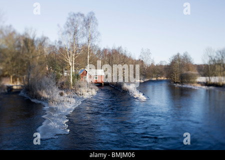 Scandinavian Peninsula, Sweden, Skane, View of house by lake Stock Photo