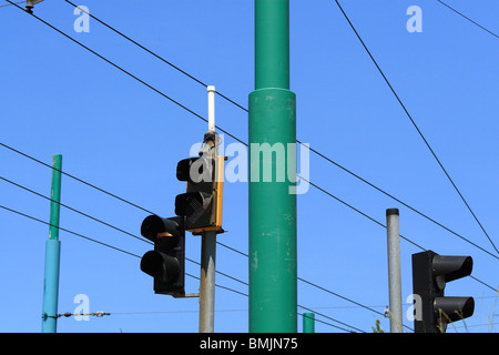 Traffic lights and tram wires against blue sky. Katowice, Poland. Stock Photo