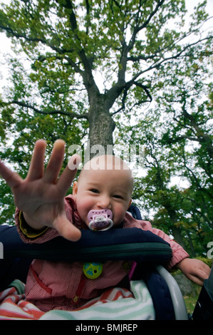 A baby girl in a pram Stock Photo