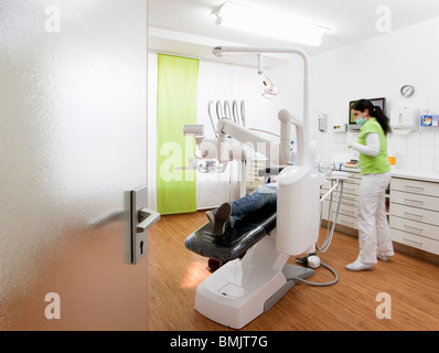 Dentist with patient in surgery Stock Photo