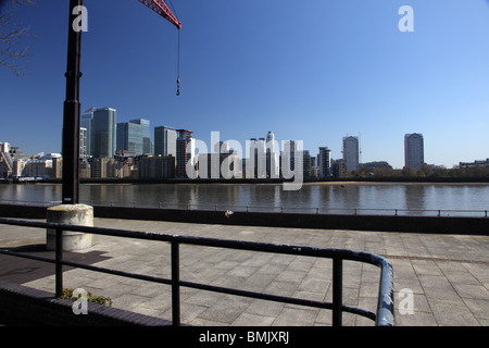 View of Canary Wharf from over the river Thames on a gloriously bright and sunny day with a clear blue sky, Rotherhithe, London. Stock Photo