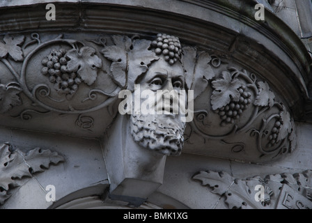 The head of Bacchus, the Roman god of wine and intoxication, known as Dionysus to the Greeks, on a building in Leith, Edinburgh. Stock Photo