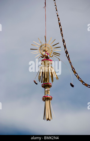 Long decorative bamboo poles, locally known as 'penjor' constructed when Balinese Hindus celebrate Galungan and Kuningan Day. Stock Photo