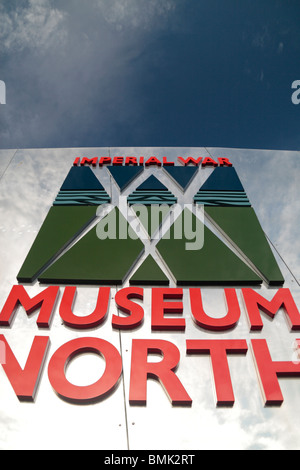 The logo and entrance sign at The Imperial War Museum North, The Quays, Salford, Manchester, UK.