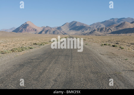 Pamir Highway leading into wilderness, Pamirs, Tajikistan Stock Photo