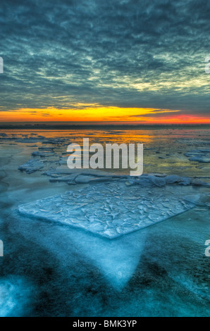 The dramatic landscape of a frozen Lake St. Clair in early morning twilight Stock Photo