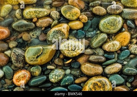 Colorful beach stones along the shores of Lake Superior in this Little Traverse Conservancy nature preserve Stock Photo