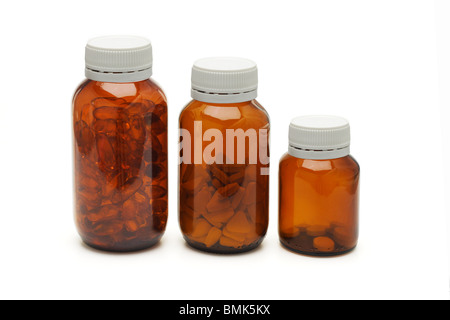 Three glass bottles of medicines on white background Stock Photo