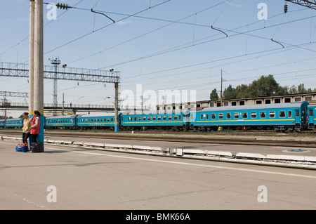 Railway station of Almaty with passengers and trains, Kazakhstan Stock Photo