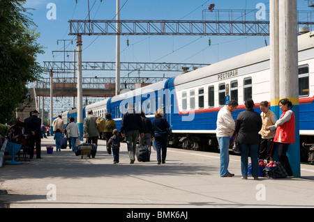 Railway station of Almaty with passengers and trains, Kazakhstan Stock Photo