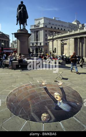 Optical illusion forced perspective trompe loeil British street chalk artist Julian Beever political caricature John Major & Paddy Ashdown well hole Stock Photo