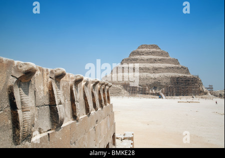 The line of cobra statues at The Step pyramid of Djoser, Saqqara, Egypt Stock Photo