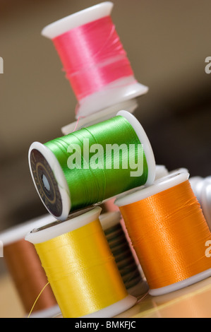 Rolls of brightly coloured cotton thread Stock Photo - Alamy