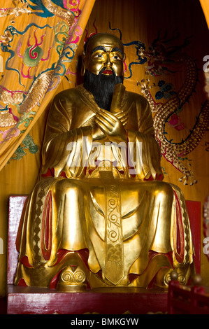 Gold statue of Confucius in the Shanghai Confucian Temple, China Stock Photo