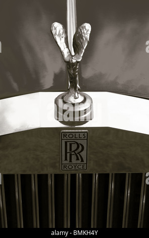 A black and white monochrome photo of the front grill and the spirit of ecstasy flying angel mascot on a Rolls Royce Bentley Stock Photo