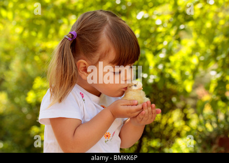 Little girl and chick Stock Photo