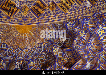 The decorative and highly geometric patterned ceiling of the Gur Amir Mausoleum in Samarkand, Uzbekistan. Stock Photo