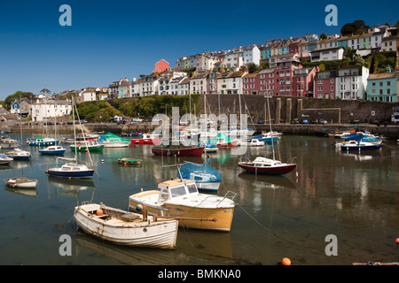 UK, England, Devon, Brixham leisure boats moored in the harbour below attractive seafront houses Stock Photo